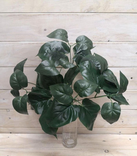 Lush rich green artificial philodendron bush, perfect for enhancing decor with low maintenance and realistic foliage.