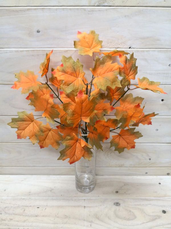 Vibrant artificial orange maple leaf bush, ideal for adding fall charm to any decor, indoors or outdoors.