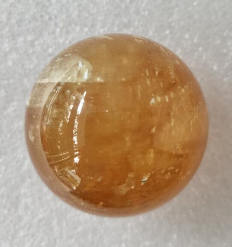 4cm Citrine Sphere featuring unique golden hues, perfect for crystal healing, meditation, and enhancing positive energy.