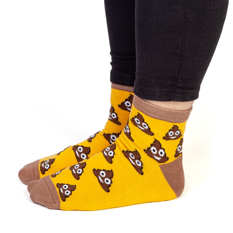 Fun Smiling Poo Socks featuring a playful design and 'SHIT HAPPENS' message on soles, perfect for casual wear.