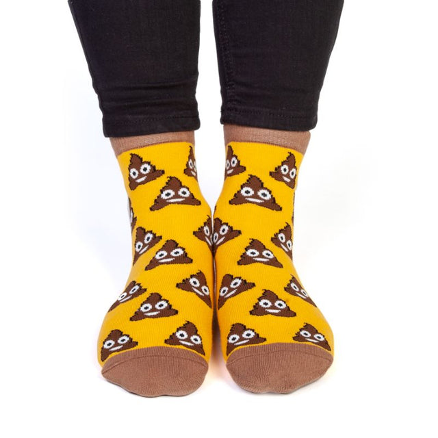 Smiling Poo Feet Speak Socks featuring a fun pattern on top and 'SHIT HAPPENS' message on the soles, perfect for comfort and humor.