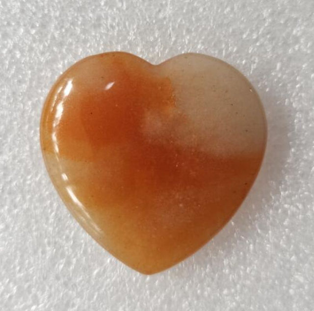 Red Aventurine heart-shaped gemstone (4cm) radiating love and positive energy, ideal for healing and decoration.
