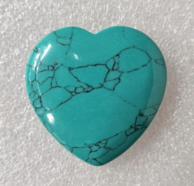 Turquoise heart gemstone (4cm) showcasing vibrant blue-green hues, ideal for healing, decor, and unique gifts.