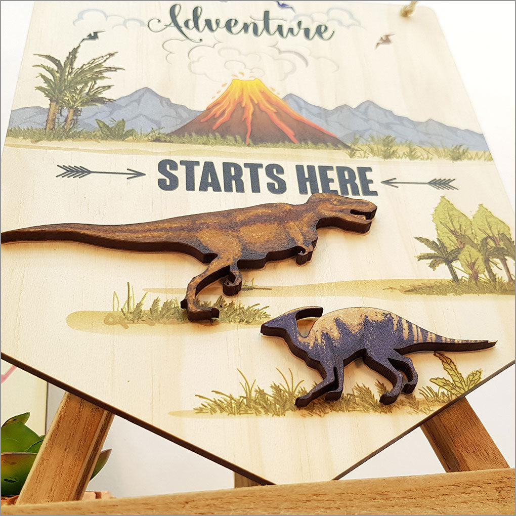 Wall art featuring "Adventure Starts Here" on eco-friendly pine, vibrant colors, and ready-to-hang design for explorers.