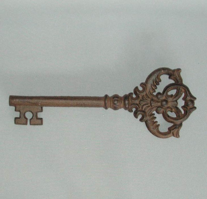 Decorative blackish cast iron key, 27cm, perfect for vintage-inspired home decor and wall accents.