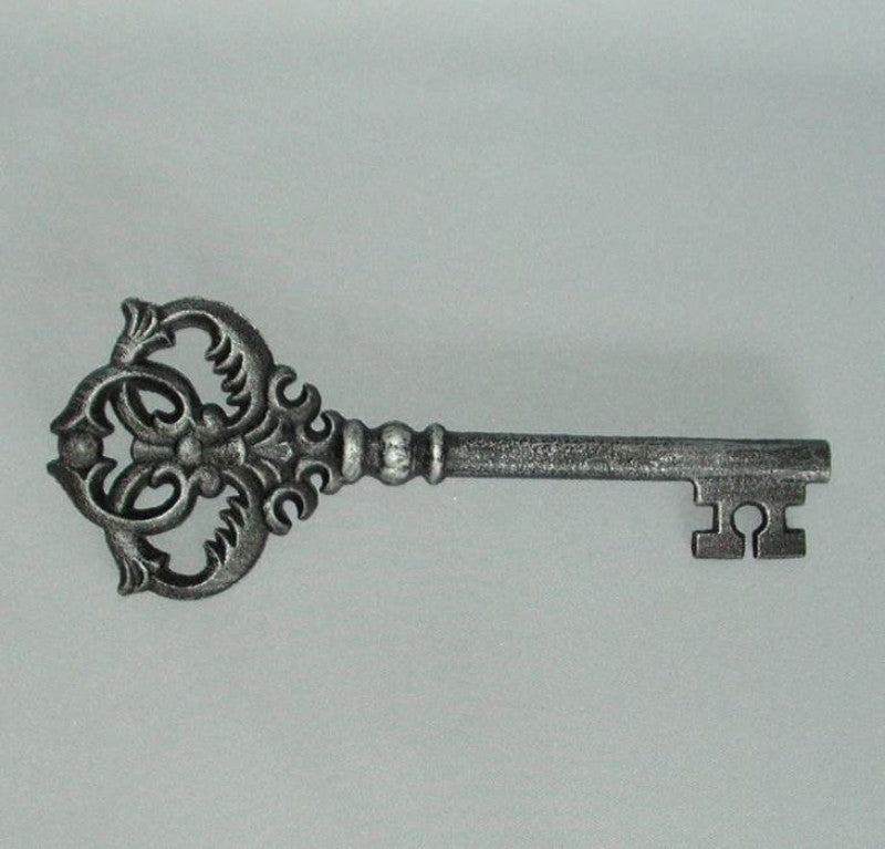 Decorative cast iron key, 27cm, black with silver wash, perfect for vintage decor and stylish home accents.