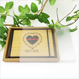Small hardbound 'Eternity' Guest Book made of FSC-certified bamboo with a laser-cut design, perfect for events and travel journaling.