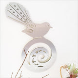 Kiwiana wall art featuring a New Zealand fantail on koru, crafted from durable ACM, ideal for indoor or outdoor decor.