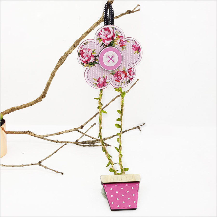 Decorative Daisy Pink Hairclip Tidy mounted on a wall, organizes hair clips beautifully while adding color to any room.