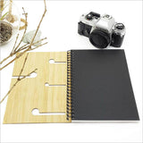 Small bamboo journal featuring laser-cut Koru design, ideal for journaling, sketching, and sustainable creativity.