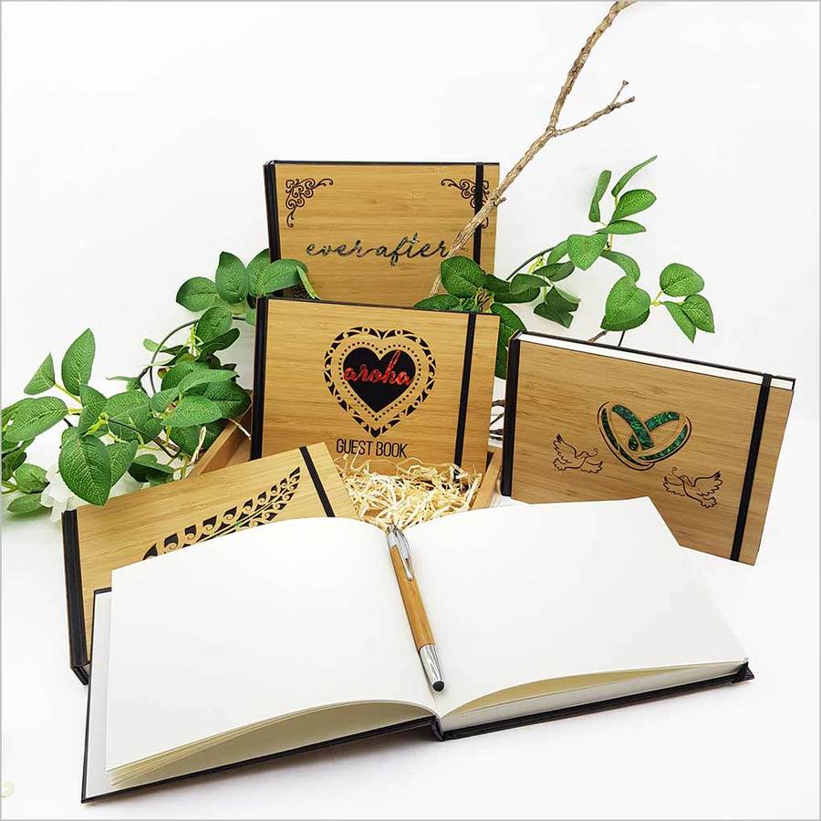 Elegant hardbound 'Eternity' guest book in bamboo, featuring laser-cut design and 128 acid-free pages for lasting memories.
