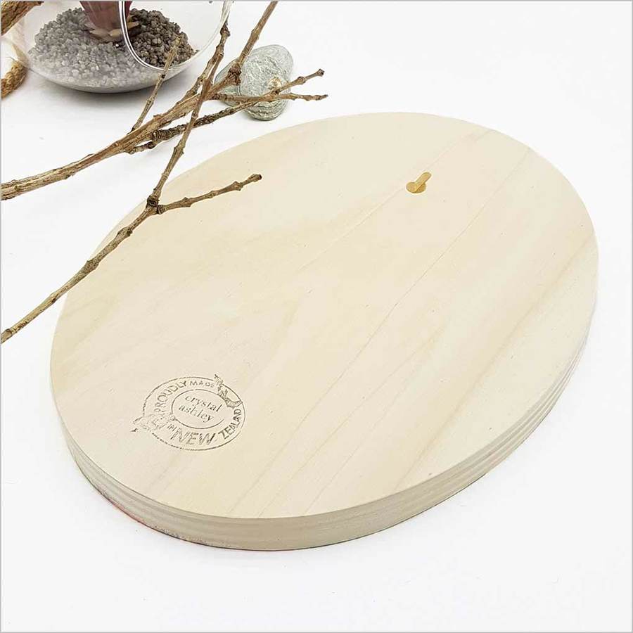 Kiwiana wall art featuring a vibrant Kiwi bird and floral designs on eco-friendly pine ply, ready to hang.