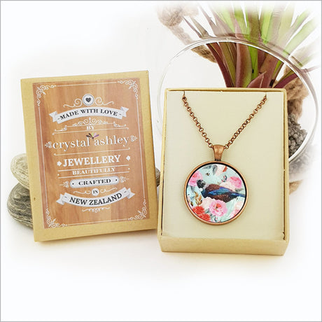 Circle necklace featuring a floral tui design on mother of pearl, with a 75cm antique copper chain and elegant gift box.