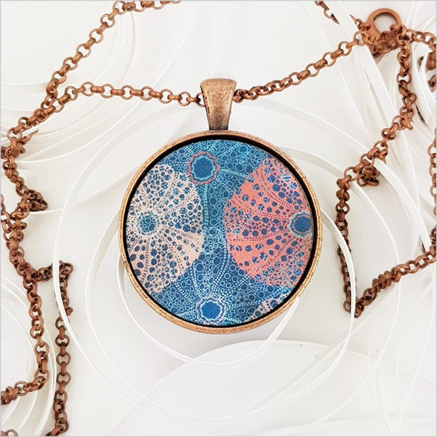 Elegant Kina Circle Necklace featuring printed mother of pearl pendant on a 75cm antique copper chain, perfect for any occasion.