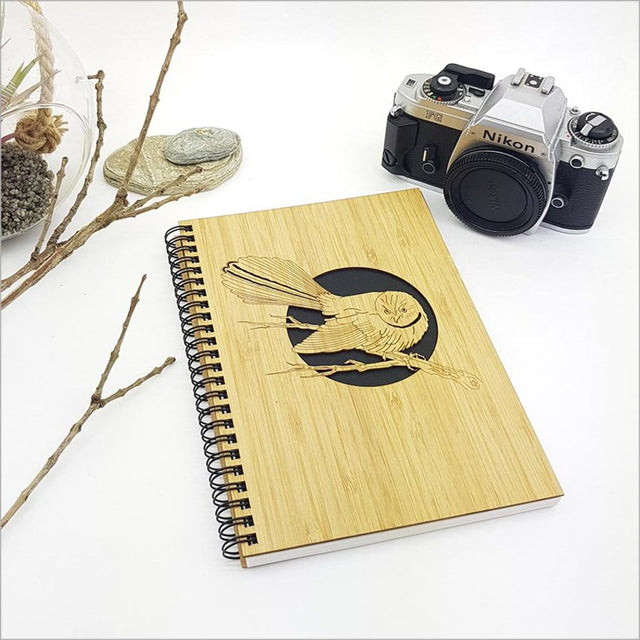 Eco-friendly small bamboo journal with elegant Fantail design, perfect for writing, sketching, or journaling on premium paper.