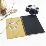 Eco-friendly Small Bamboo Journal with laser-cut Fantail design, 110 pages of premium cartridge paper, perfect for writing or sketching.