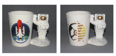 Set of 2 astronaut-shaped handle mugs, crafted from ceramic, perfect for space lovers and fun beverage experiences.