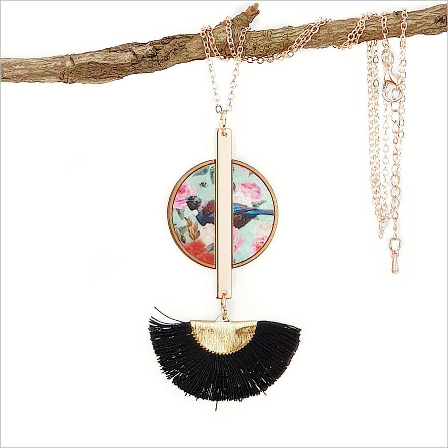 Floral Tui Tassel Necklace featuring rose gold pendant on mother of pearl, inlaid in NZ Silver Beech, with 24-inch chain.