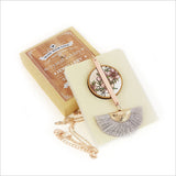 Elegant Manuka Tassel Necklace featuring a mother of pearl pendant with rose gold finish, 24" chain, and silk tassel.