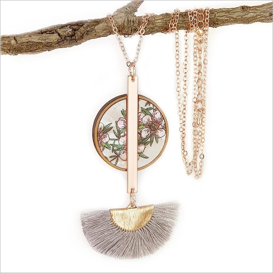 Elegant Manuka Tassel Necklace featuring a mother of pearl pendant, rose gold finish, and silk tassel, perfect for any occasion.