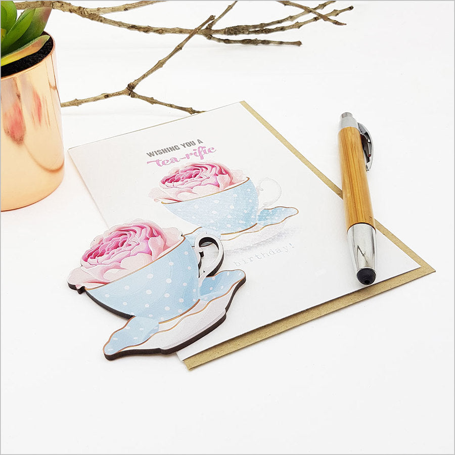 Elegant tea cup greeting card on textured cardstock, perfect for tea lovers, with blank interior for personal messages.