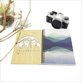 Small bamboo journal featuring a unique laser-cut design, ideal for travel notes, sketches, or daily reflections.