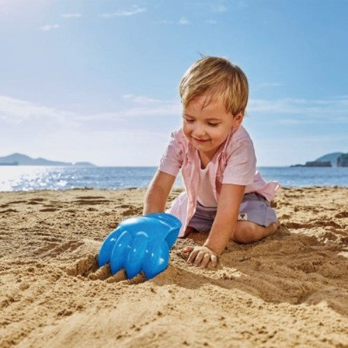 Bright blue Hape Power Paw Toy for kids 18+ months, designed for imaginative sand play and outdoor adventures.