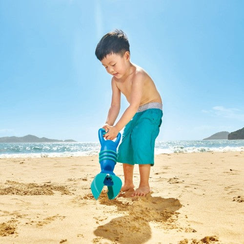 Hape Grabber Sand Toy in blue, designed for kids 2+, easily scoops up sand and treasures for imaginative outdoor play.