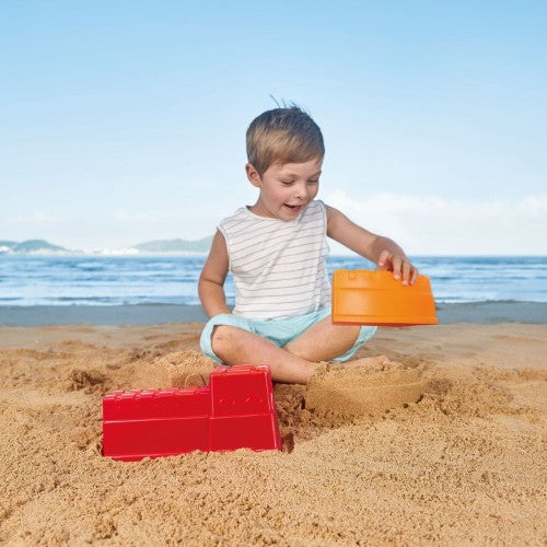 Colorful Hape Great Castle Walls sand toys designed for toddlers to build imaginative sand structures inspired by the Great Wall of China.