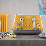 Bright yellow De'Longhi Icona Capitals toaster, 4 slots, with 6 browning settings and bagel, defrost, reheat options.