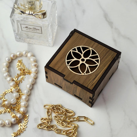 Unique 8cm trinket box made from reclaimed River Rimu Flower wood, showcasing distinct colors and patterns in a stylish design.