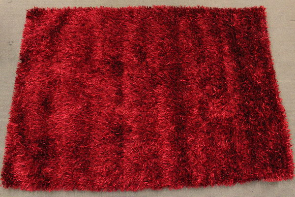 Handmade red shaggy rug (1.6 x 2.3m) featuring a soft texture, durability, and vibrant colors for stylish home decor.
