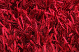 Handmade shaggy red rug (1.6 x 2.3m) with a soft, plush texture, perfect for enhancing any living space.