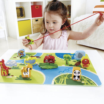 Colorful wooden safari animals on a jigsaw puzzle mat, perfect for imaginative play and skill development in toddlers.