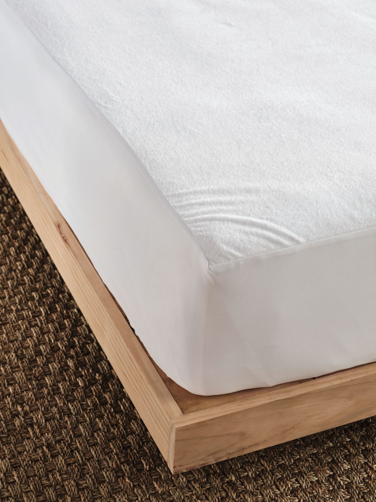 Everyday Waterproof Mattress Protector by Savona for queen beds, featuring soft cotton terry and waterproof backing for ultimate mattress protection.
