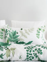 Luxurious Freya duvet cover set by Savona in white, featuring lush foliage design on soft 100% cotton sateen.