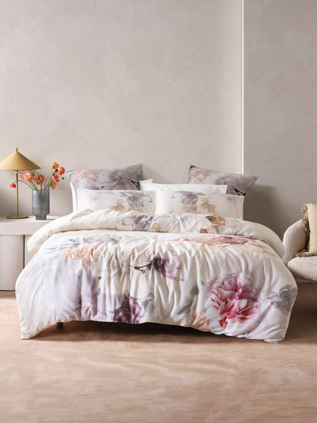 King duvet cover set by Savona featuring floral design of roses and peonies in blush, white, apricot, and taupe hues.