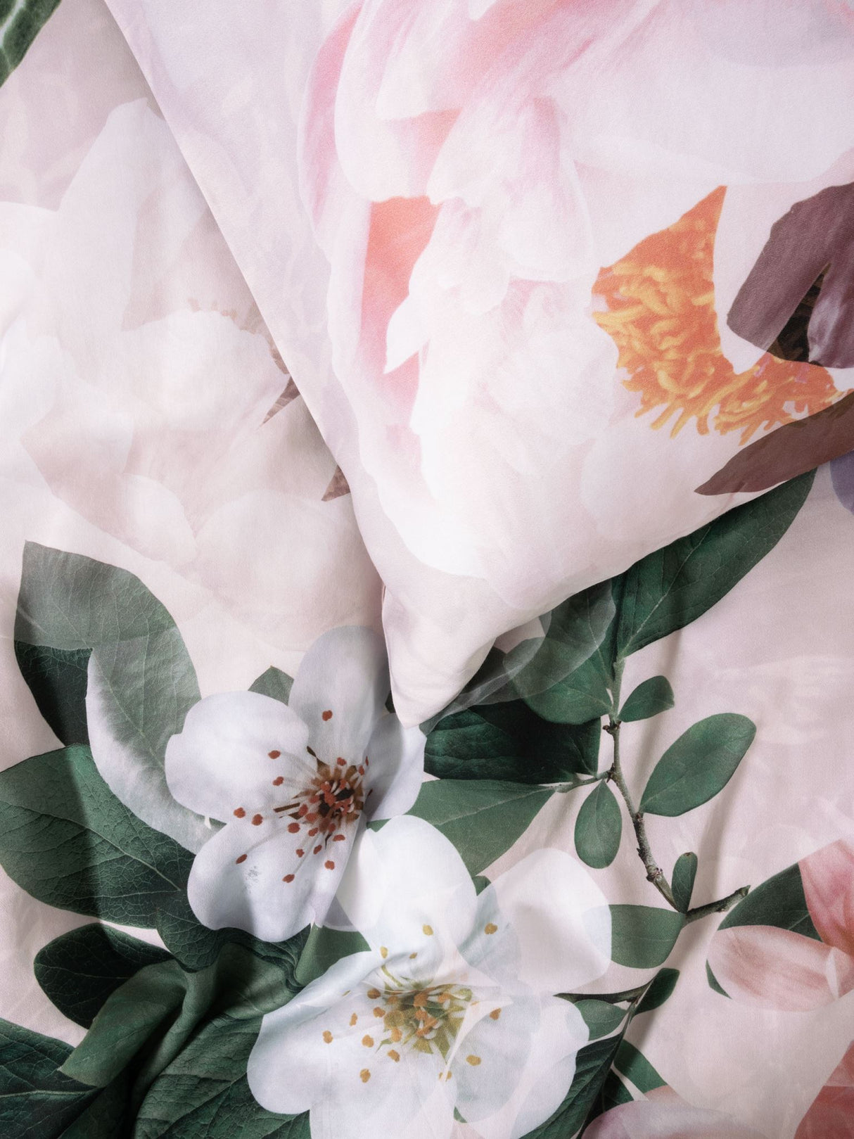 Elegant blush duvet cover set with large floral prints, crafted from soft 100% cotton sateen, perfect for a romantic bedroom.