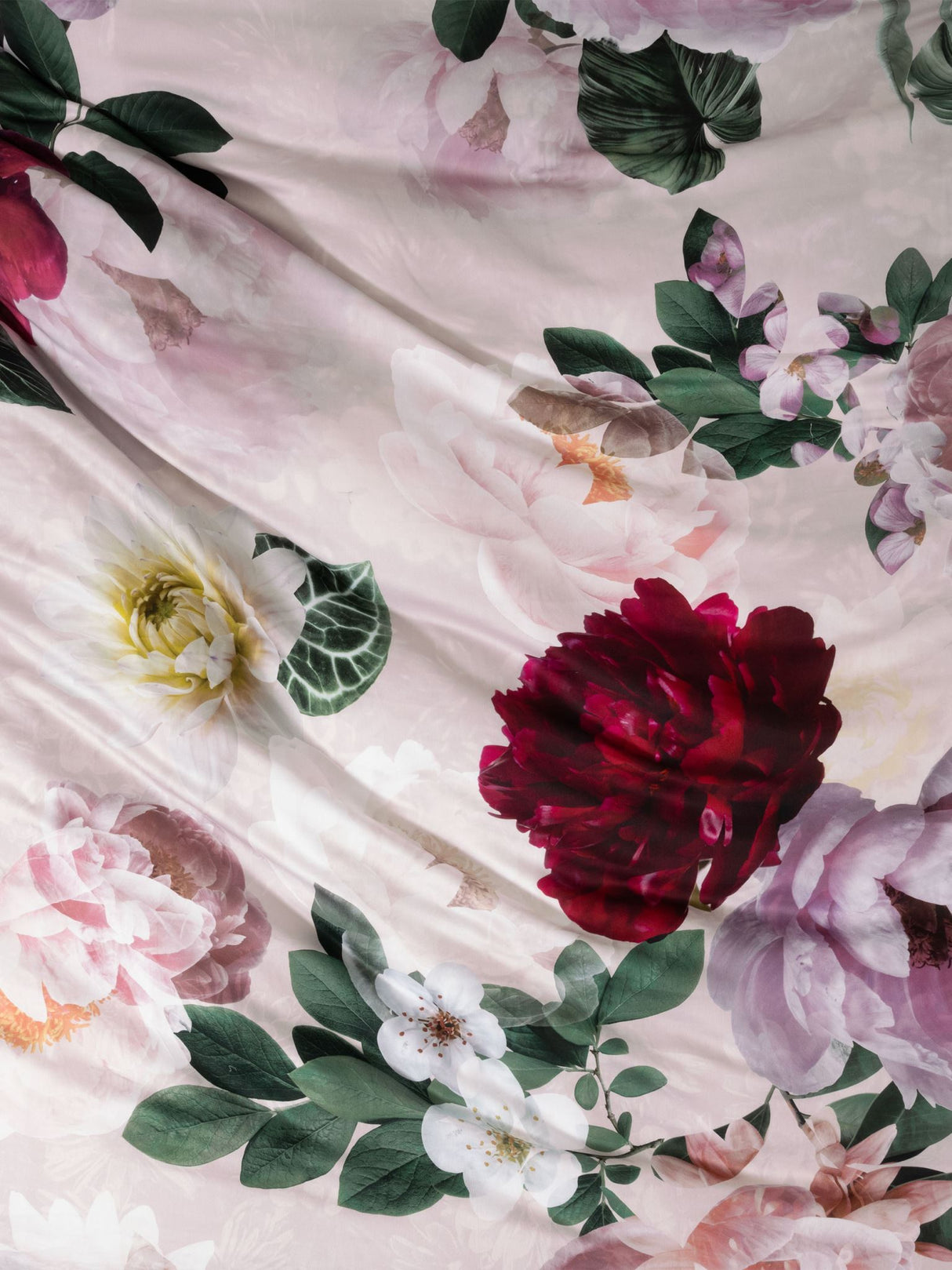 King duvet cover set by Savona in blush with large floral prints for a romantic, elegant bedroom aesthetic.