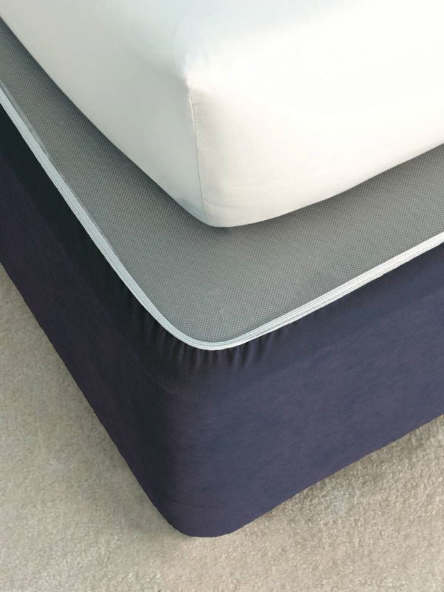 Elegant navy faux suede bedwrap for single beds, featuring elasticized edges for a tailored fit and easy maintenance.