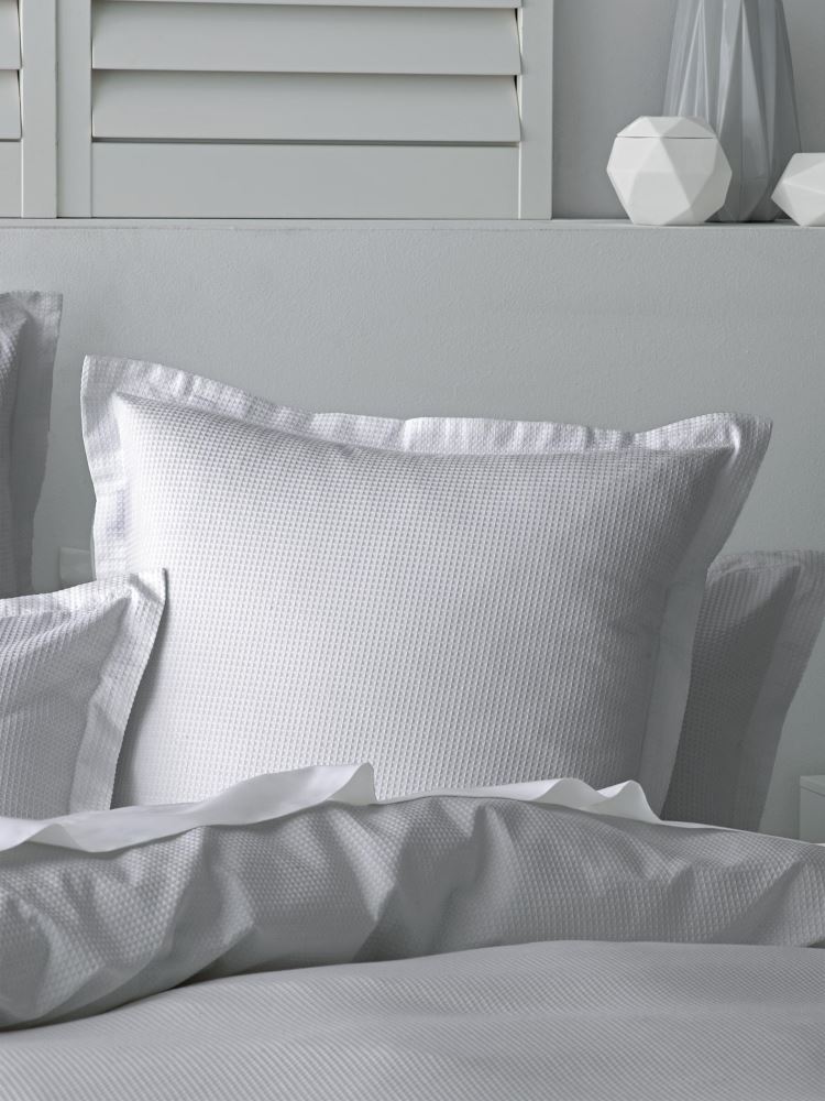 Sleek Nova Silver Duvet Set featuring textured waffle design and soft percale reverse, perfect for stylish bedroom comfort.