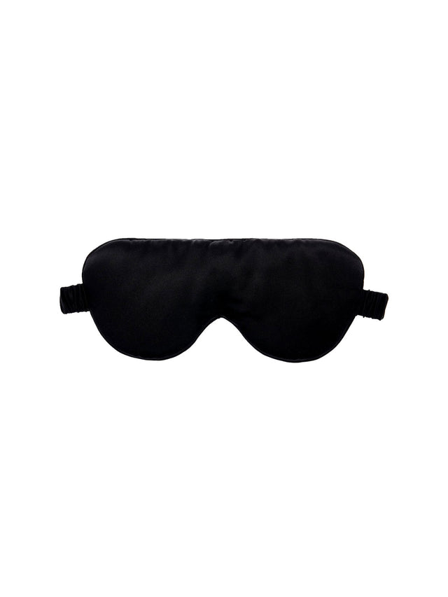 Luxurious black silk sleep mask by Savona with adjustable band, blocking light for ultimate relaxation and rejuvenation.