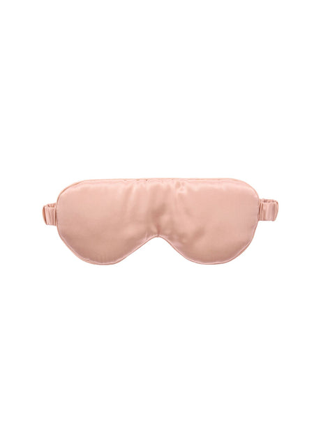 Soft blush silk sleep mask by Savona for comfortable light-blocking, protecting the delicate eye area for restful sleep.