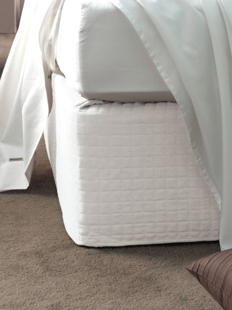 Elegant white suede quilted bed wrap for single beds, providing a chic finish without removing mattress or linens.
