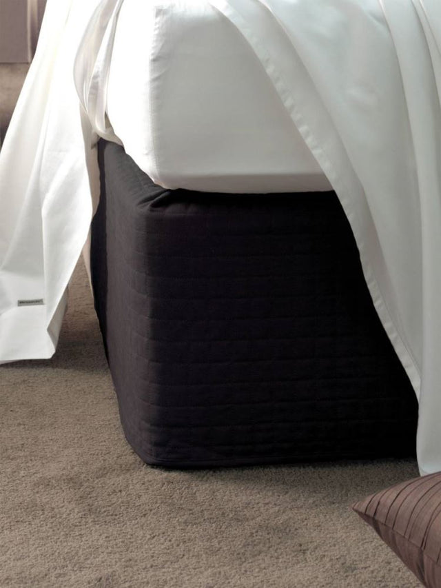 Black suede quilted bed wrap for double beds, effortlessly enhancing bed linen without removing the mattress.