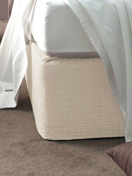 Cream suede quilted bedwrap for Super King bed, elevating decor with luxury, style, and easy installation.