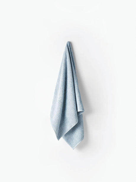 Plush blue bath mat by Savona, 60x80cm, made of 900GSM cotton, offering comfort, absorbency, and fast-drying features.
