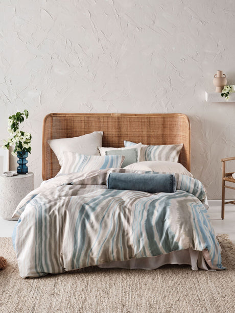 Queen duvet cover set featuring hand-painted marble-like design in blue and earth tones, crafted from soft cotton sateen.