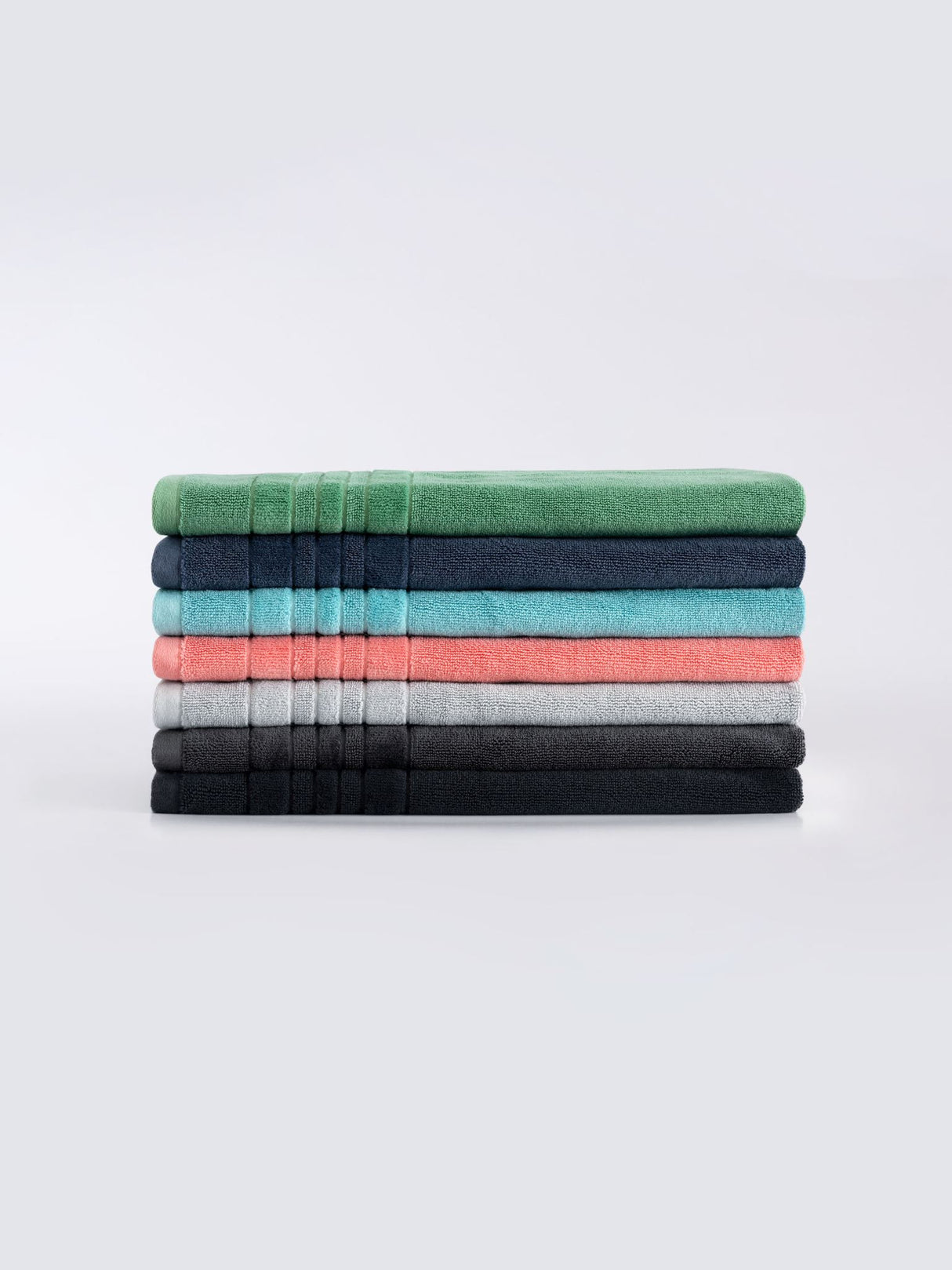 Soft SEAGLASS bath mat by Savona features luxurious 900 GSM cotton and chic velour striped hem for elegant bathroom decor.