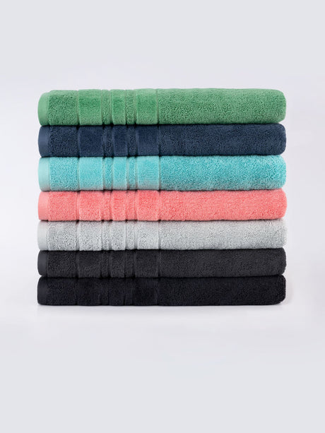 Luxurious teal Selene Bath Sheet by Savona, crafted from 550 GSM cotton, featuring plush velour stripes for ultimate comfort.